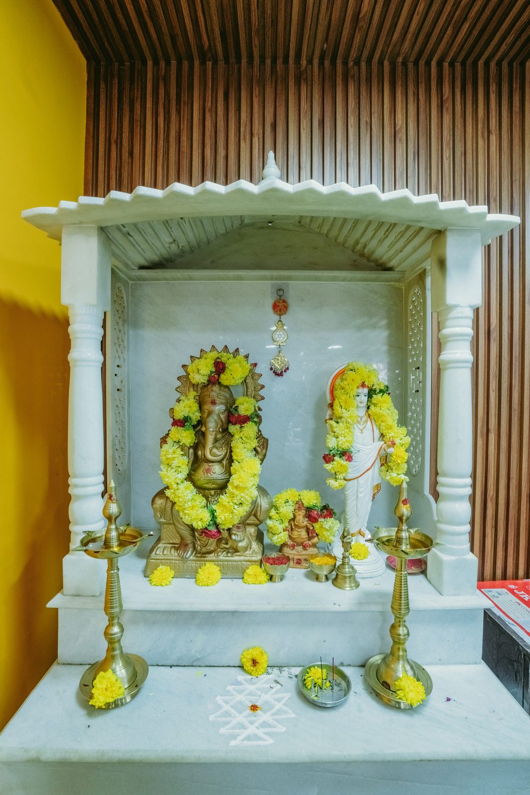 Decorated pooja shrine within the clinic