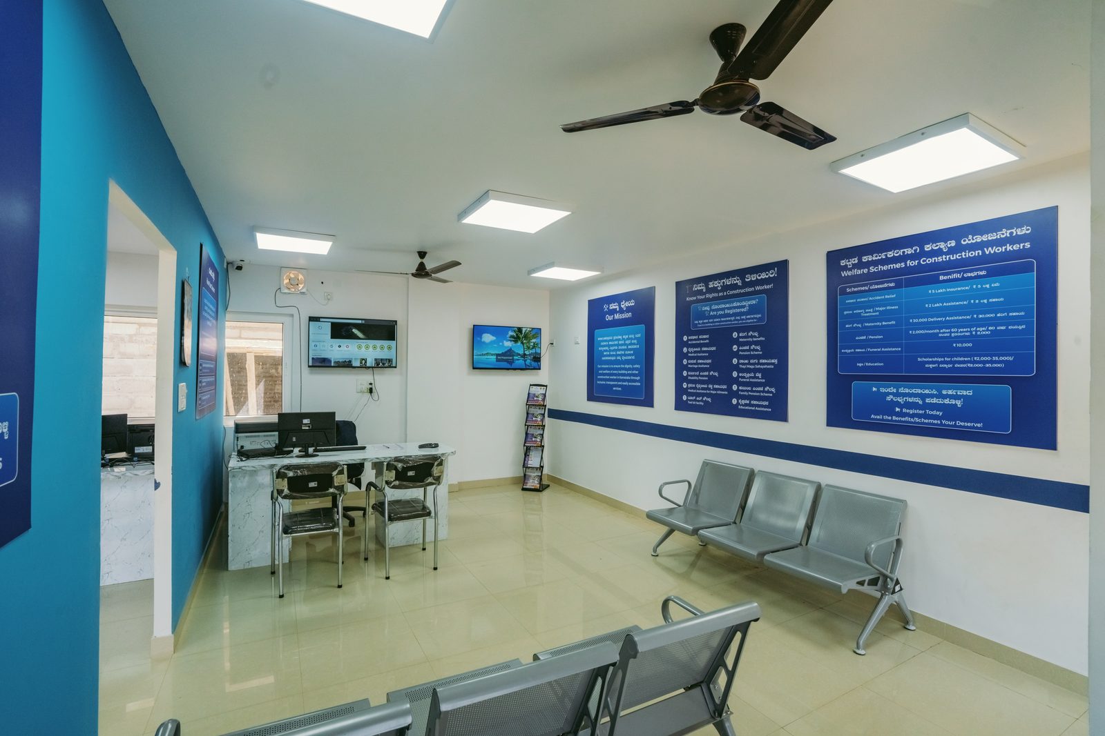 Waiting area with information boards and workstations