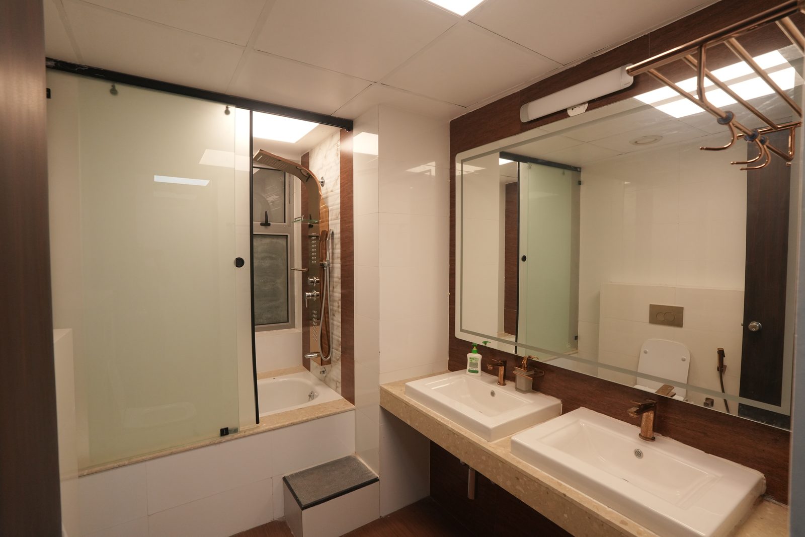Master bathroom with twin vanities and glass shower