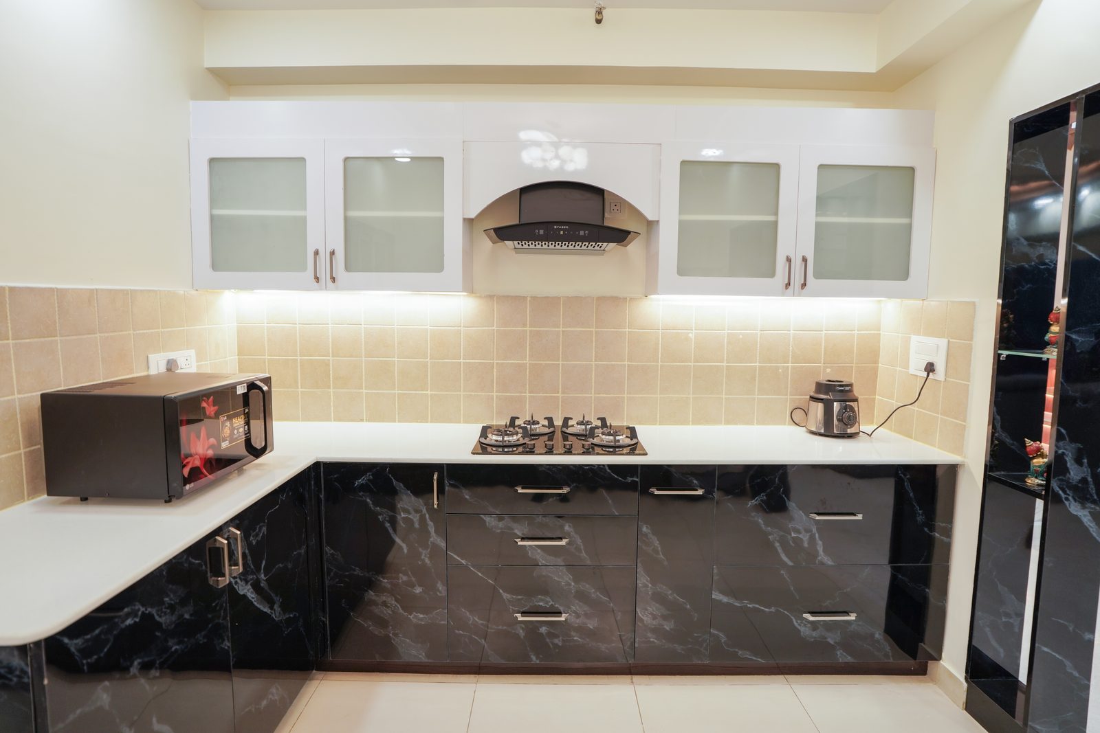 Black marble modular kitchen with breakfast counter